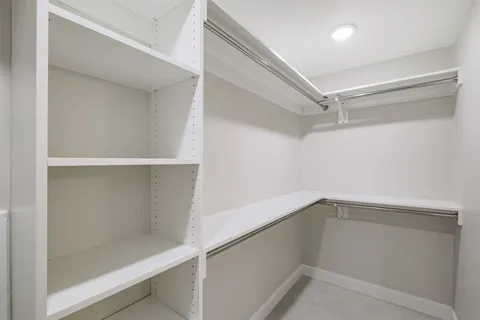 a view of an empty walk in closet