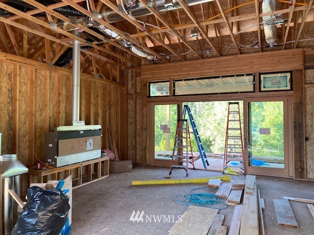 320 Kokanee Loop Cle Elum, WA 98922 - Photo 4 of 14 a living room with patio furniture and a floor to ceiling window
