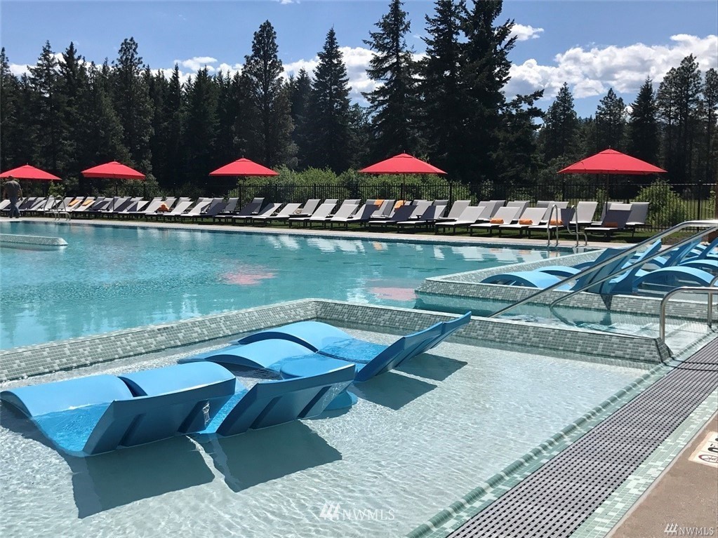 320 Kokanee Loop Cle Elum, WA 98922 - Photo 7 of 14 a view of swimming pool with table and chairs