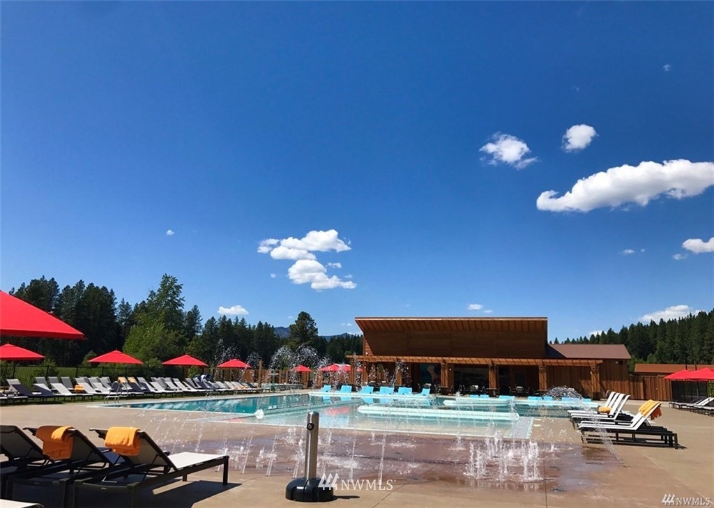 320 Kokanee Loop Cle Elum, WA 98922 - Photo 8 of 14 a view of a swimming pool with an outdoor seating and a potted plant
