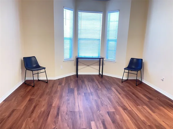 a bedroom with a bed and a chair