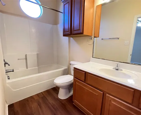 a bathroom with a sink a toilet and bathtub