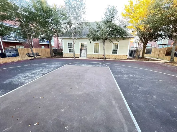 a front view of a house with a road and a yard