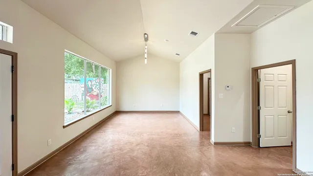 an empty room with windows