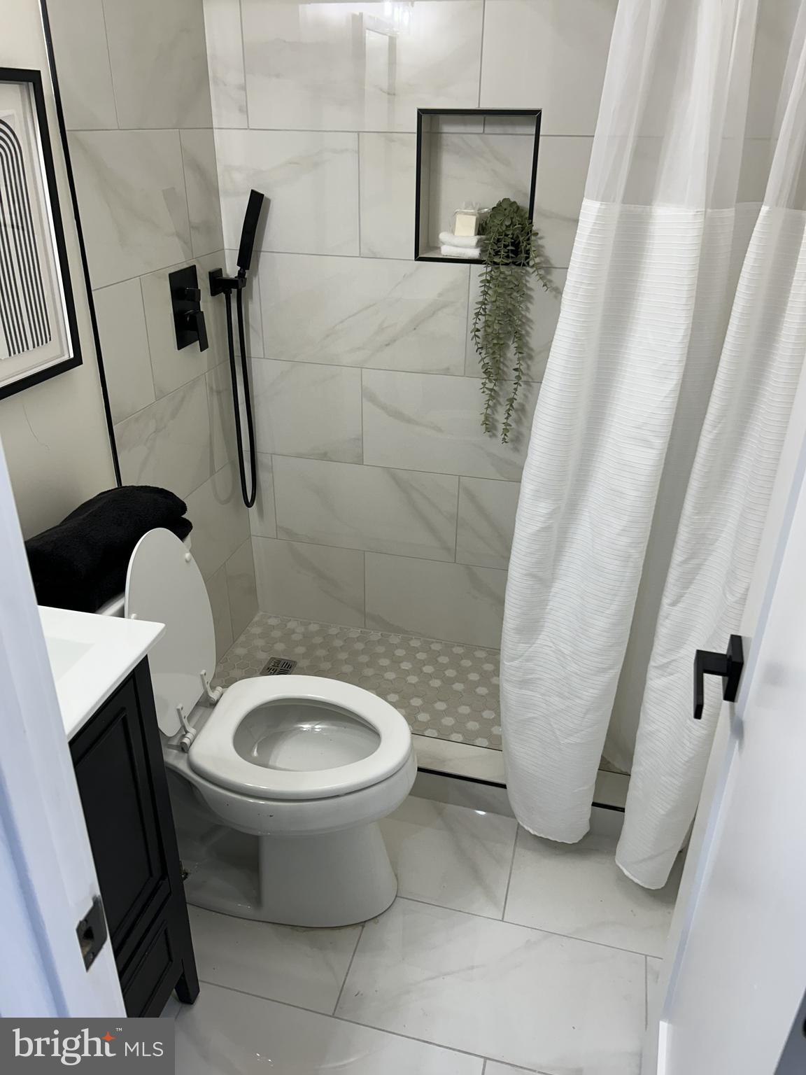 928 Perry Place Northeast Washington, DC 20017 - Photo 13 of 16 a bathroom with a sink and toilet