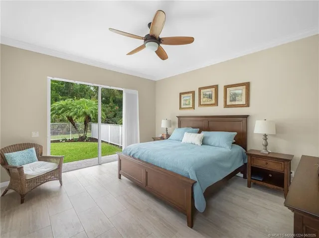 a bedroom with a bed and a chair