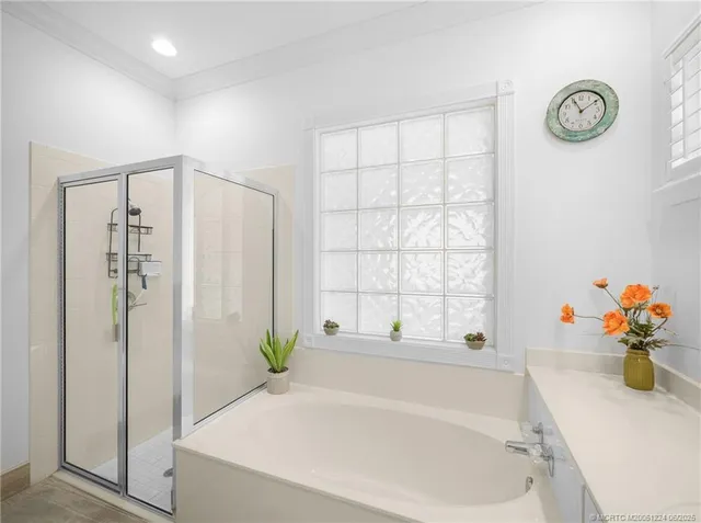 a white bath tub with a window