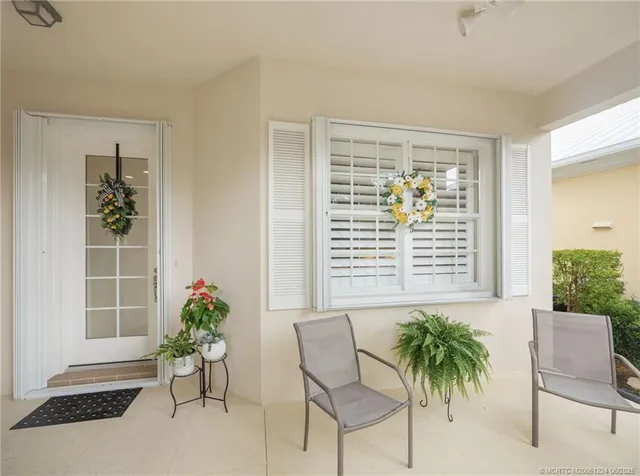 a view of a chair and table in a room