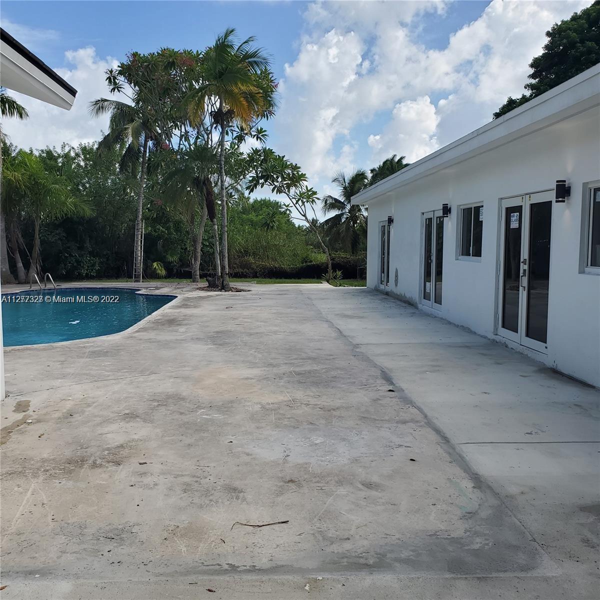 35220 Southwest 213th Avenue Homestead, FL 33034 - Photo 19 of 46 POOL DECK FOR ENTERTAINMENT
