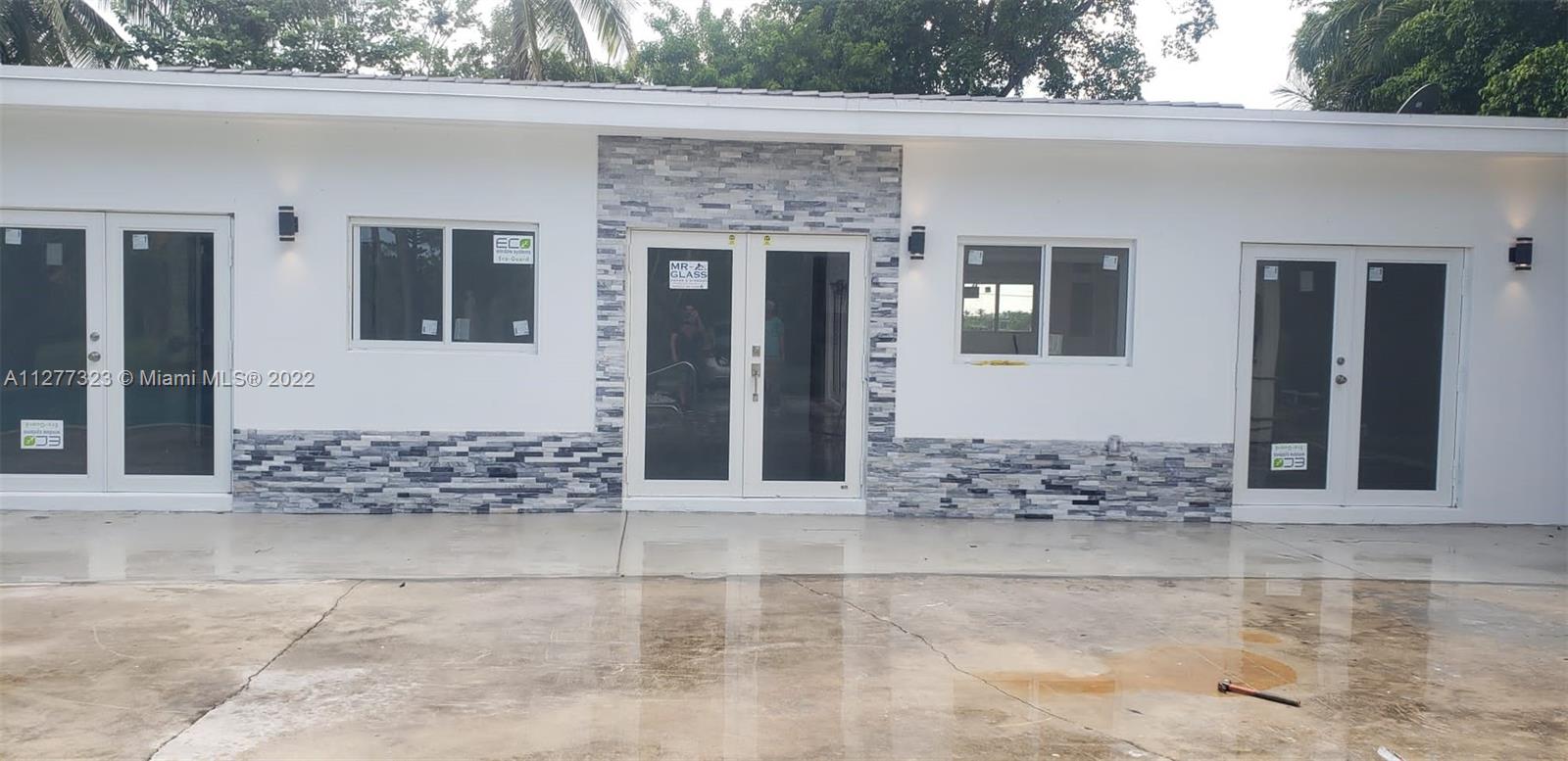 35220 Southwest 213th Avenue Homestead, FL 33034 - Photo 2 of 46 EXTERIOR FRONT ENTRANCE WITH POOL VIEW