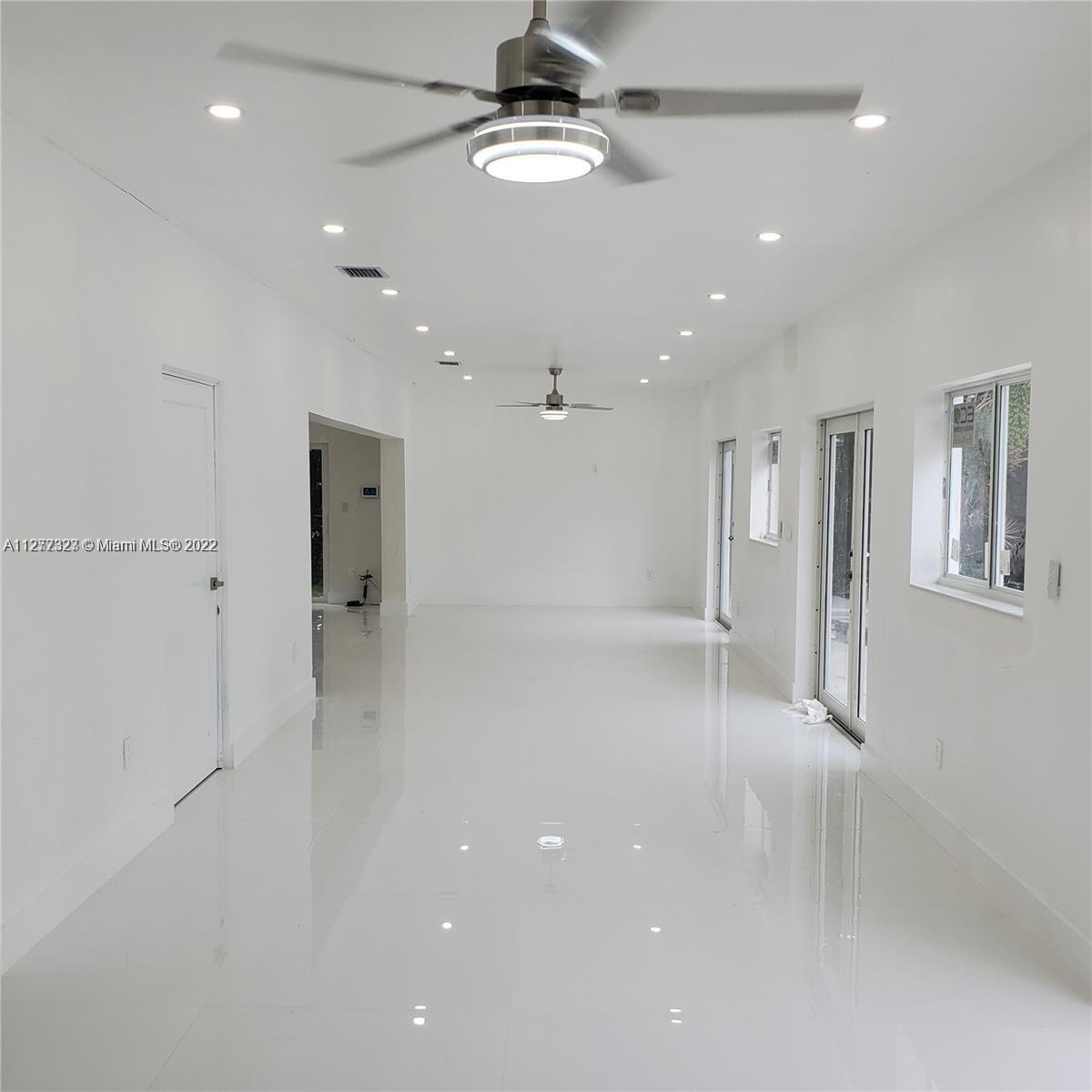 35220 Southwest 213th Avenue Homestead, FL 33034 - Photo 23 of 46 LOBBY/ENTAIMENT AREA WITH POOL VIEW