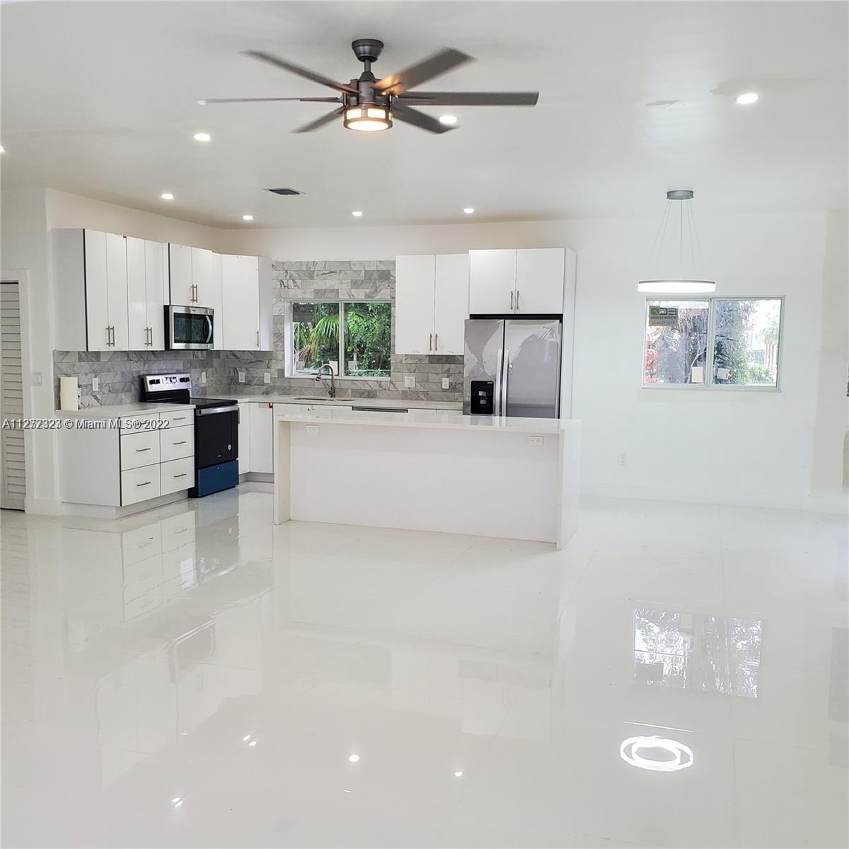 35220 Southwest 213th Avenue Homestead, FL 33034 - Photo 27 of 46 OPEN KITCHEN WITH ISLAND