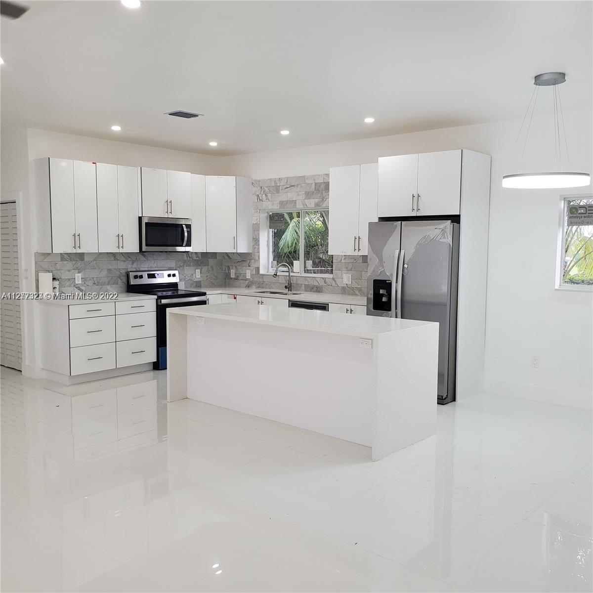 35220 Southwest 213th Avenue Homestead, FL 33034 - Photo 29 of 46 OPEN KITCHEN & ISLAND WITH QUARTZ COUNTERTOPS