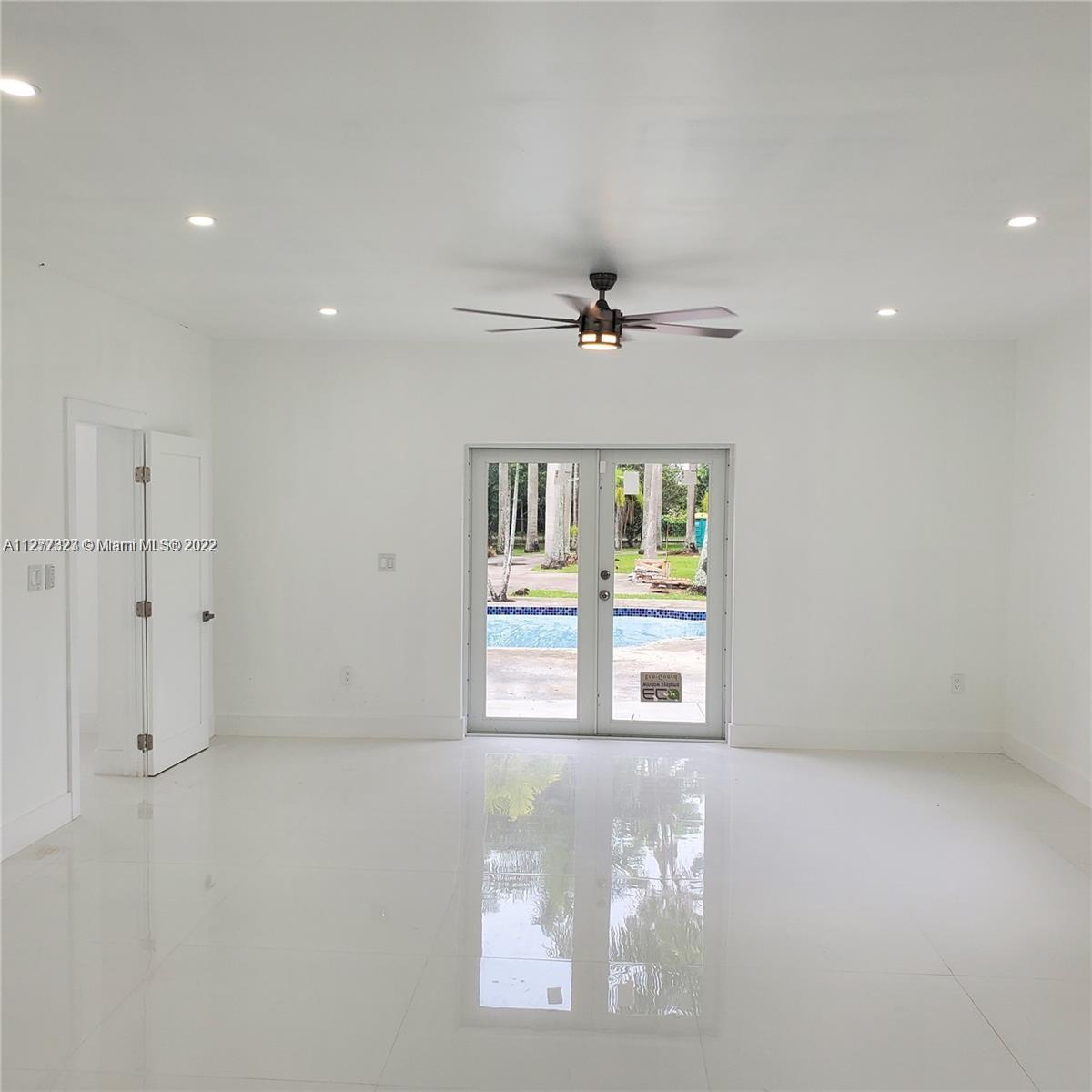 35220 Southwest 213th Avenue Homestead, FL 33034 - Photo 32 of 46 MASTER BEDROOM GRAND ROOM WITH POOL VIEW