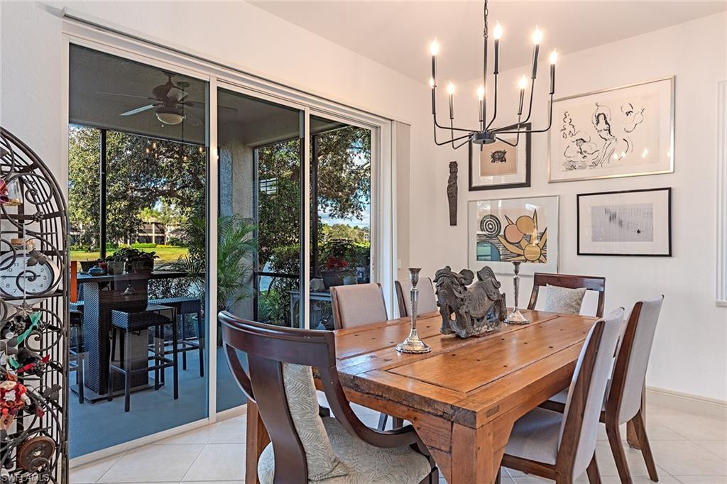 745 Regency Reserve Circle, Unit 5202 Naples, FL 34119 - Photo 4 of 14 a view of a dining room with furniture window and outside view