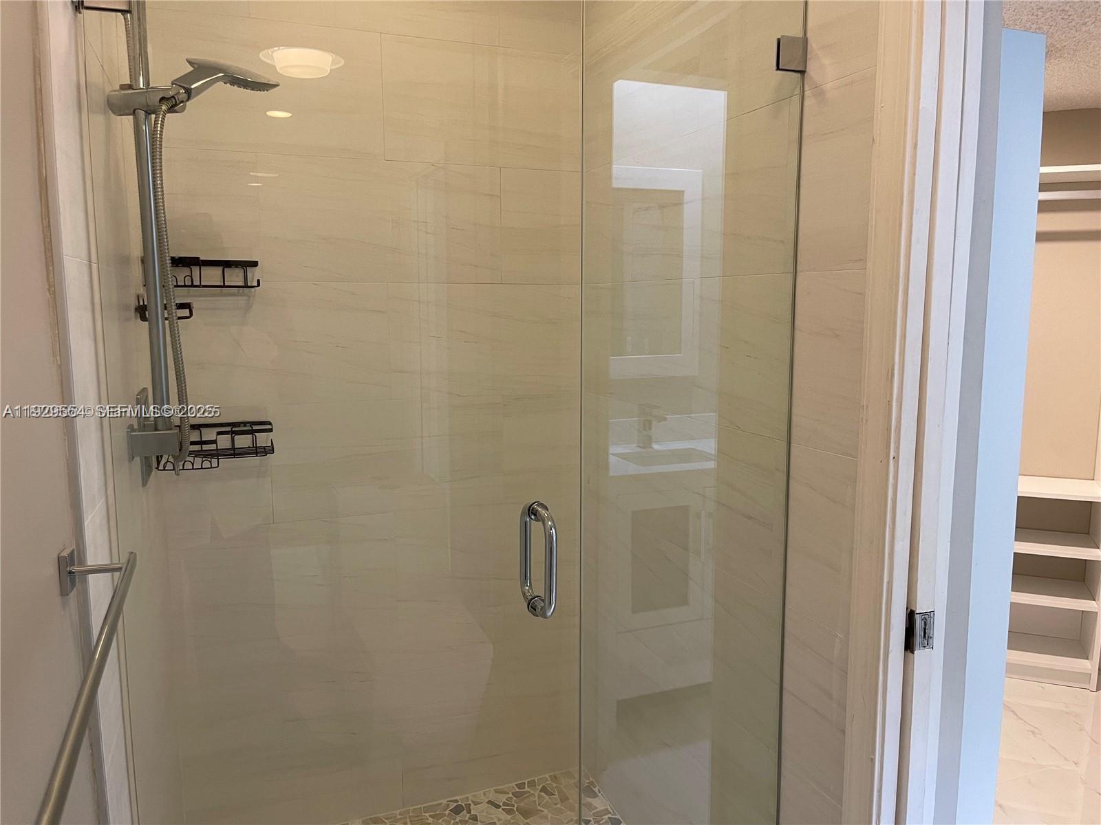 10101 Northwest 5th Street, Unit 10101 Plantation, FL 33324 - Photo 19 of 29 a bathroom with a shower
