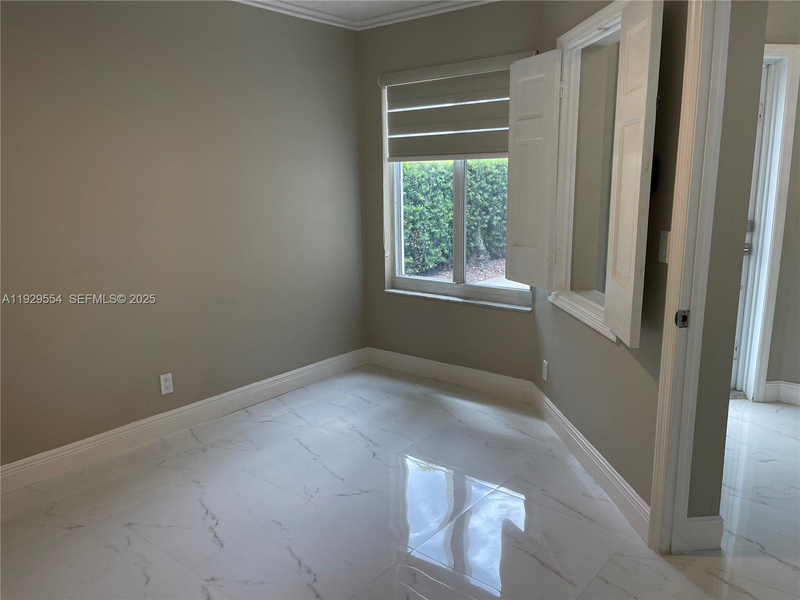 10101 Northwest 5th Street, Unit 10101 Plantation, FL 33324 - Photo 24 of 29 an empty room with windows