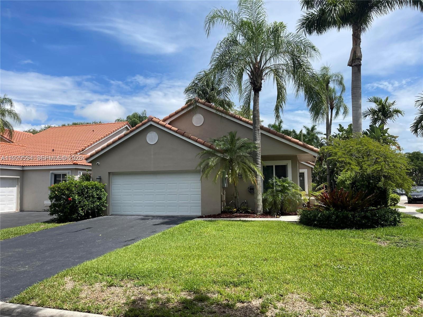 10101 Northwest 5th Street, Unit 10101 Plantation, FL 33324 - Photo 28 of 29 front view of house with a yard
