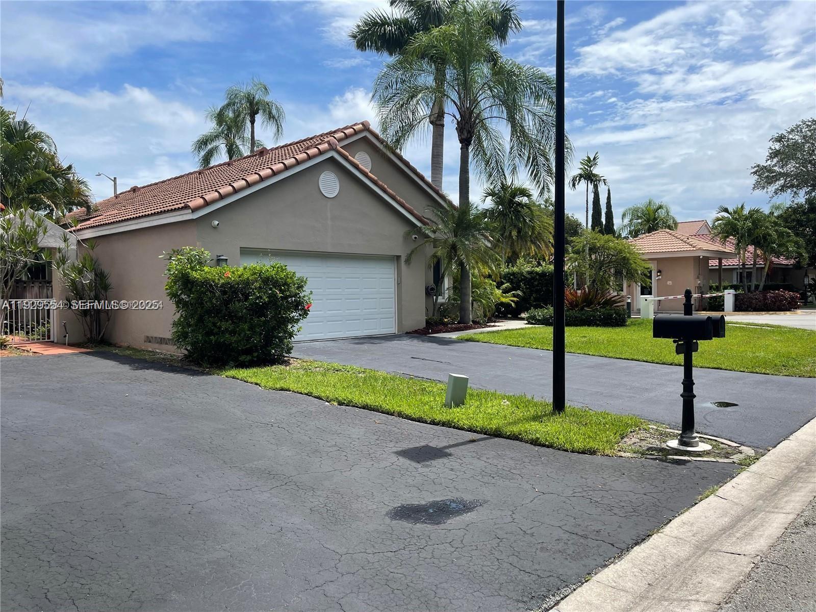 10101 Northwest 5th Street, Unit 10101 Plantation, FL 33324 - Photo 29 of 29 a front view of house with yard and green space