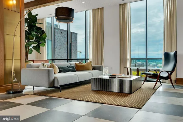 a living room with furniture and a large window