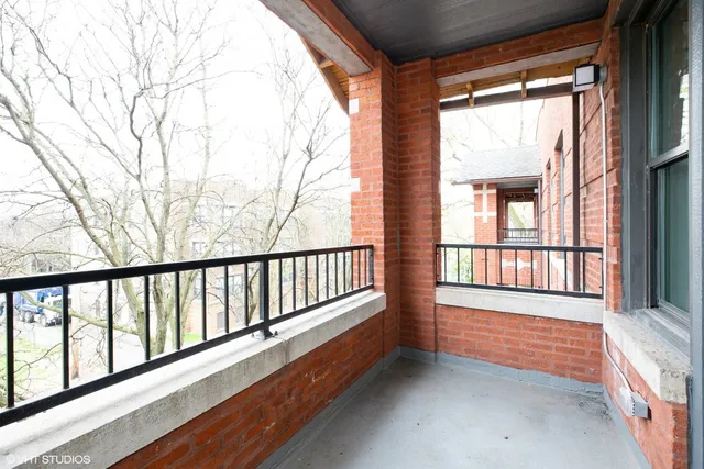 a view of porch with wooden floor