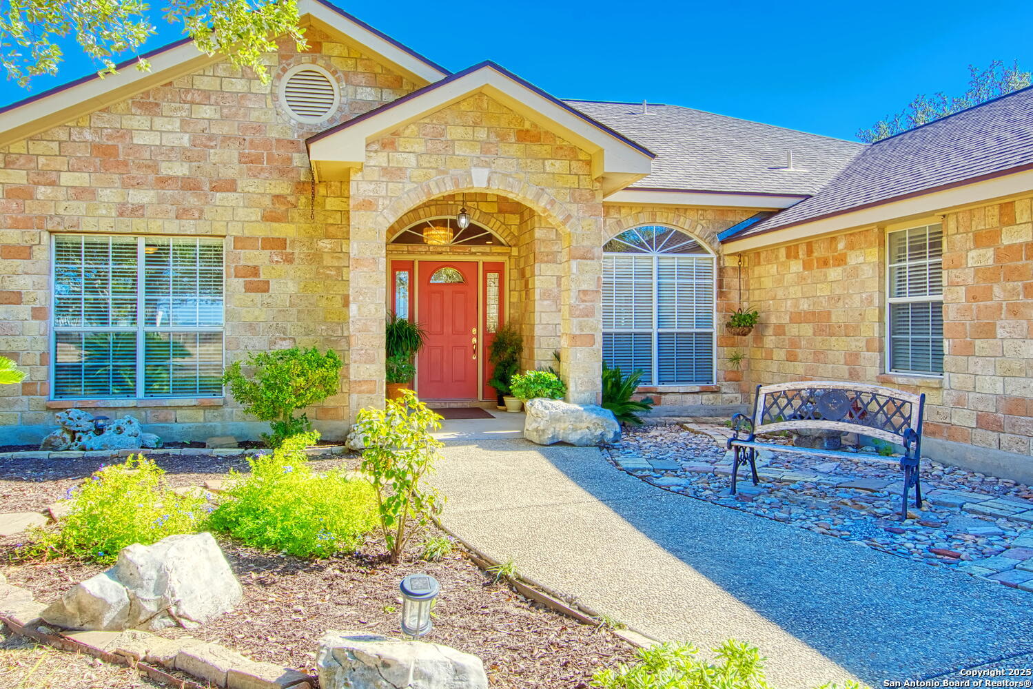 15260 Miller Road St. Hedwig, TX 78152 - Photo 11 of 48 a front view of a house with garden
