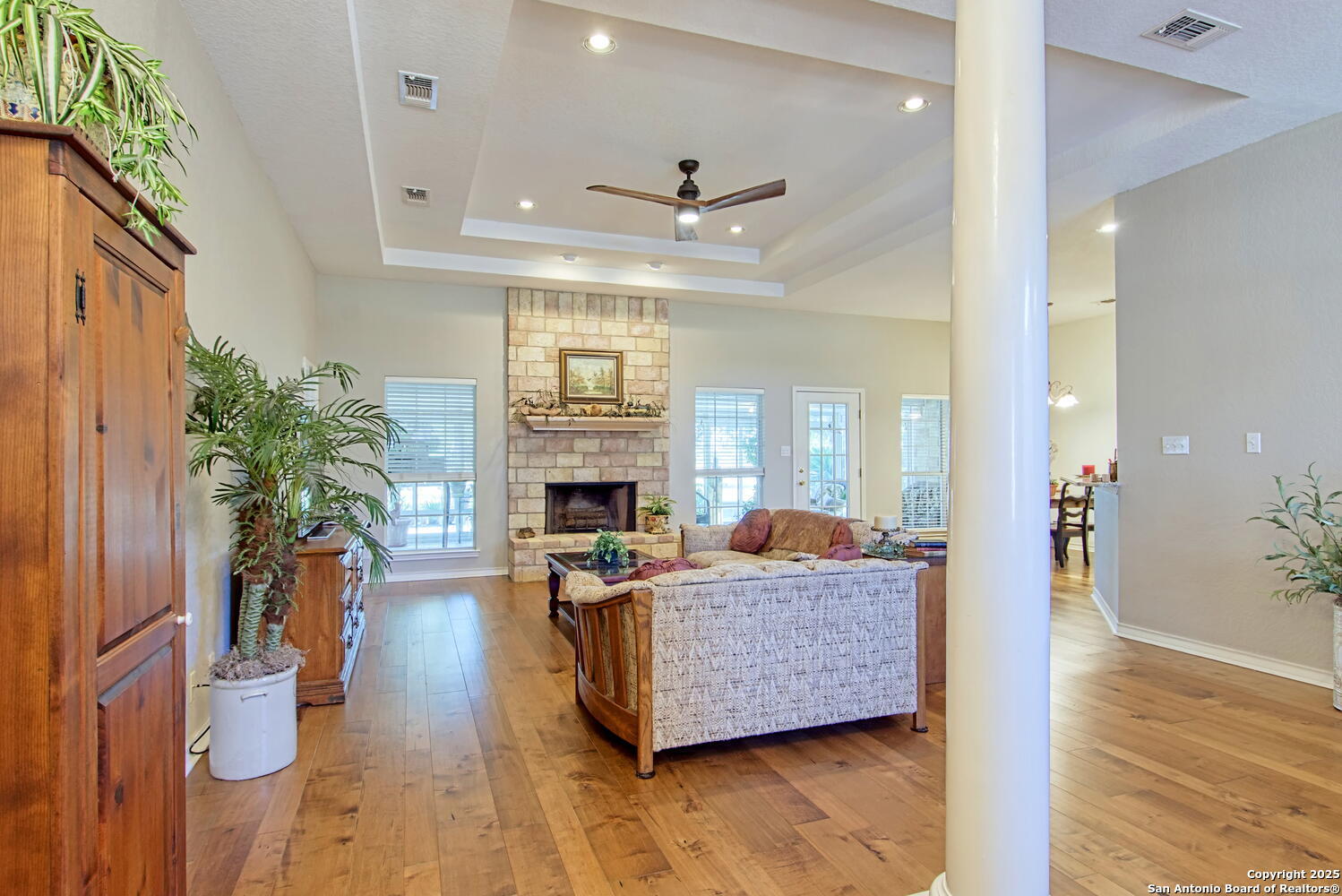 15260 Miller Road St. Hedwig, TX 78152 - Photo 13 of 48 a living room with furniture a fireplace and a potted plant