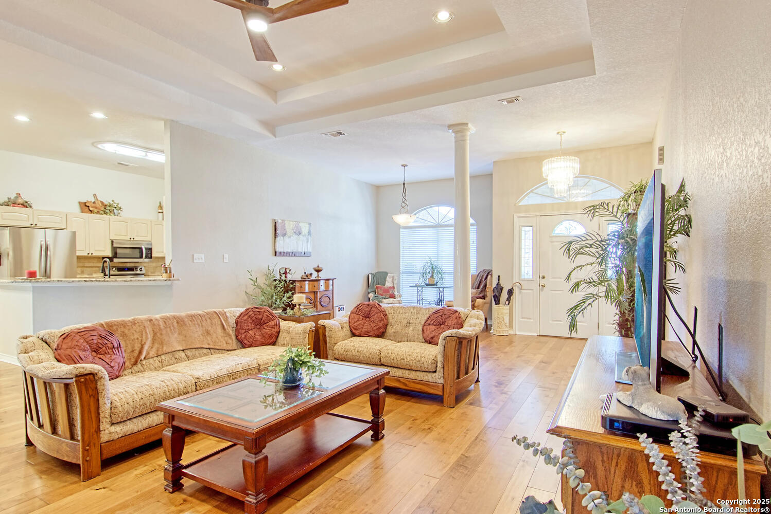 15260 Miller Road St. Hedwig, TX 78152 - Photo 16 of 48 a living room with furniture a wooden floor and a large window
