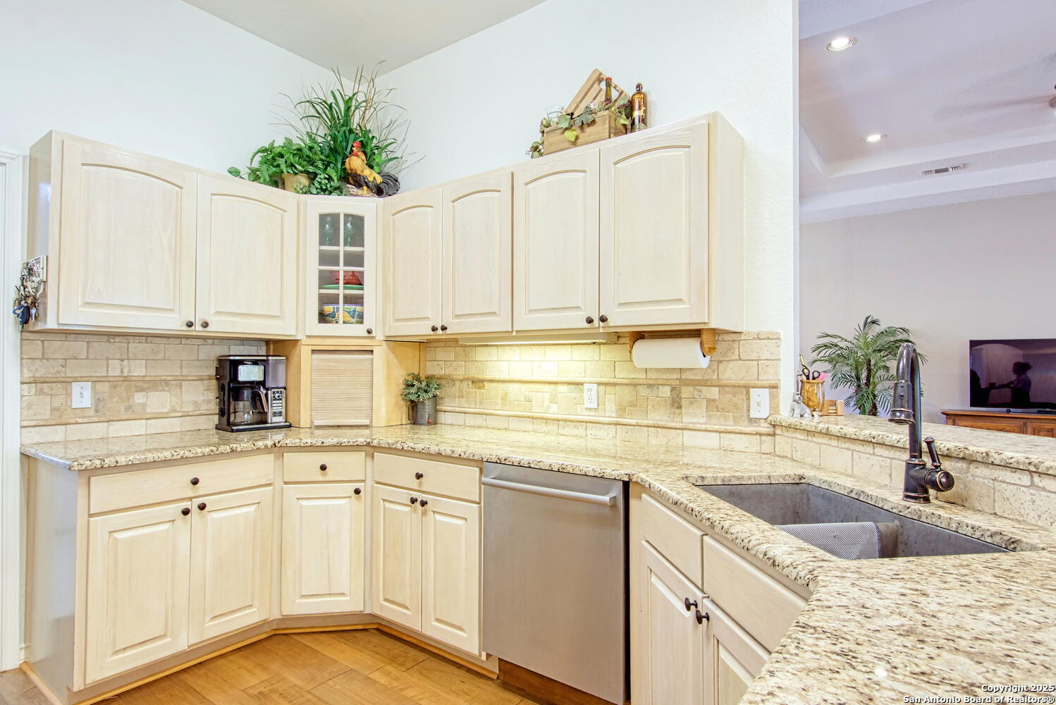 15260 Miller Road St. Hedwig, TX 78152 - Photo 22 of 48 a kitchen with white cabinets sink and white appliances