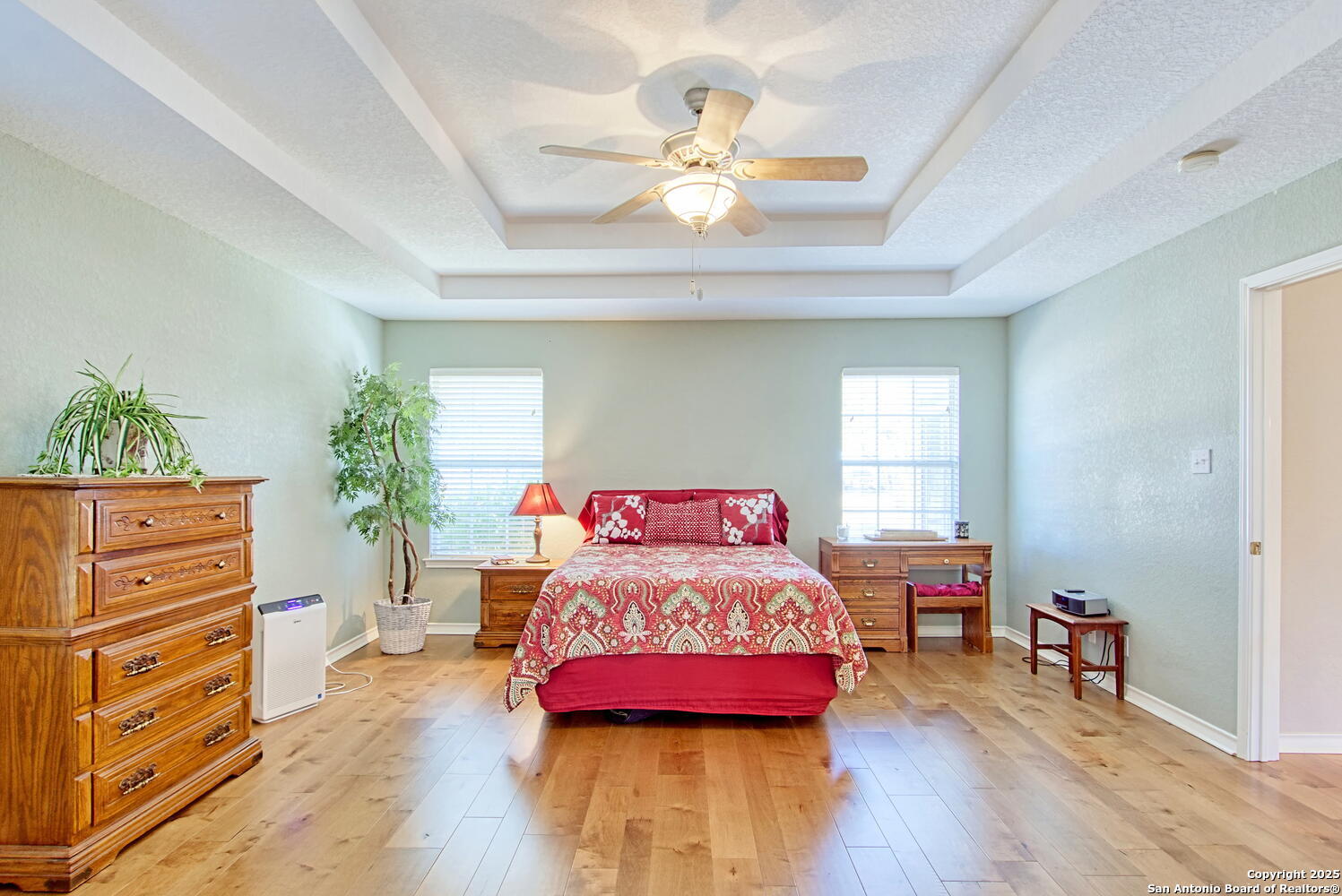 15260 Miller Road St. Hedwig, TX 78152 - Photo 29 of 48 a bedroom with a bed and wooden floor