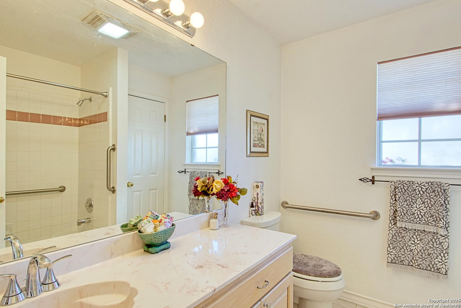 15260 Miller Road St. Hedwig, TX 78152 - Photo 34 of 48 a bathroom with a sink mirror vanity and toilet