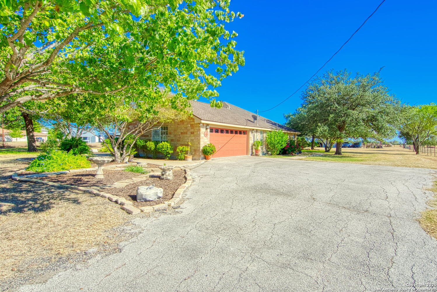 15260 Miller Road St. Hedwig, TX 78152 - Photo 9 of 48 a view of house with outdoor space and street view