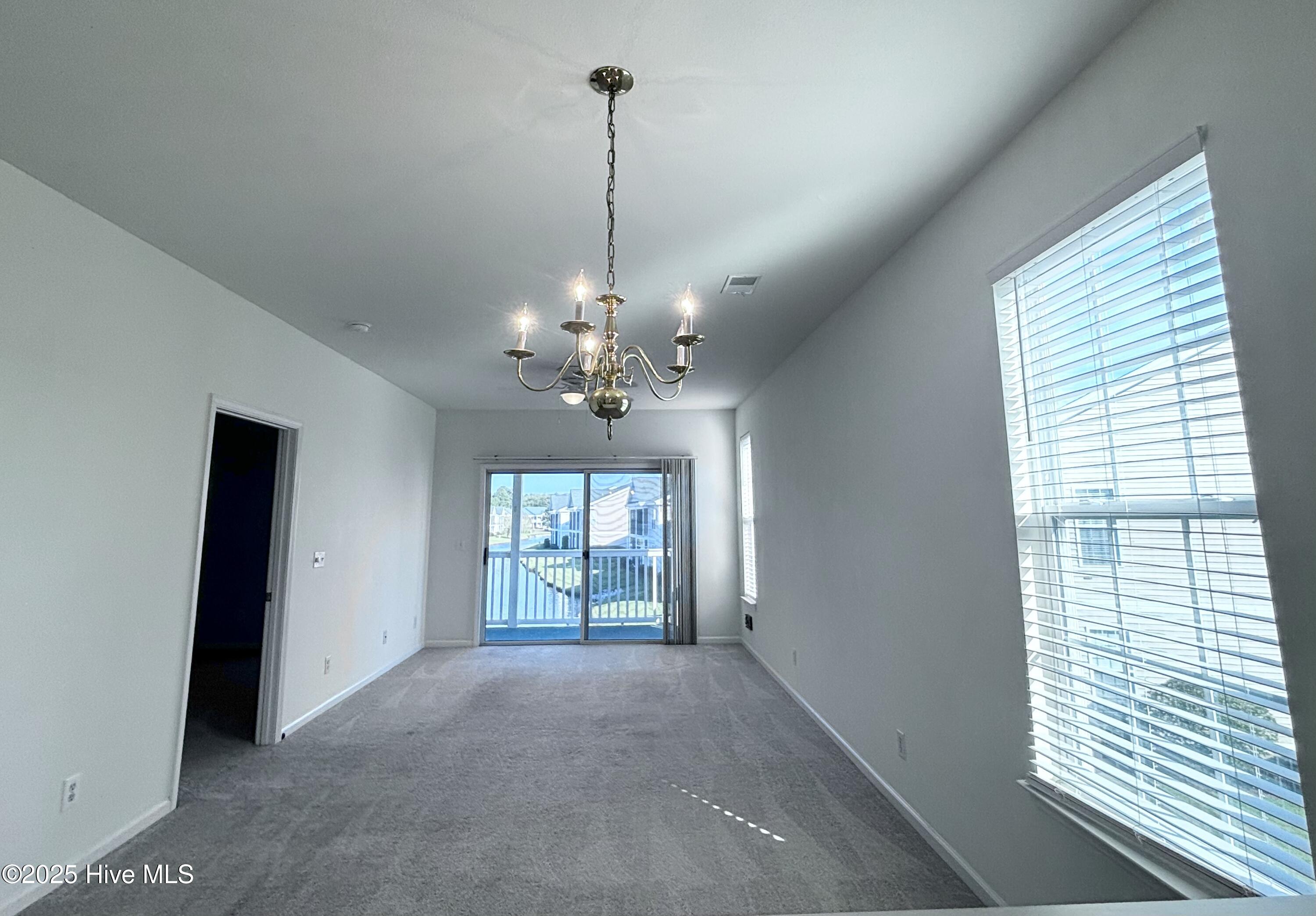 7509 Moorhen Lane Southwest, Unit 52D Sunset Beach, NC 28468 - Photo 5 of 39 Dining room & living room 1