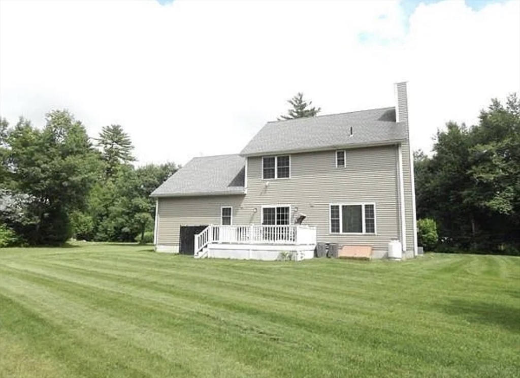 17 Two Ponds Road Belchertown, MA 01007 - Photo 3 of 23 a front view of house with yard and trees