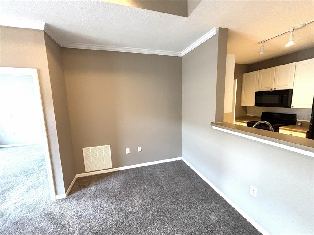 4221 West Spruce Street, Unit 1418 Tampa, FL 33607 - Photo 12 of 22 a view of livingroom with kitchen