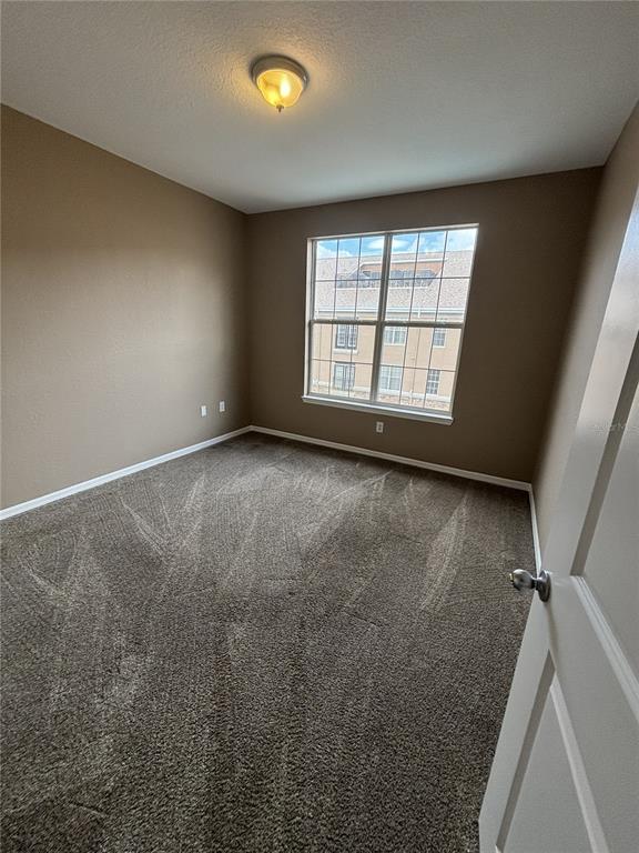 4221 West Spruce Street, Unit 1418 Tampa, FL 33607 - Photo 16 of 22 an empty room with a window