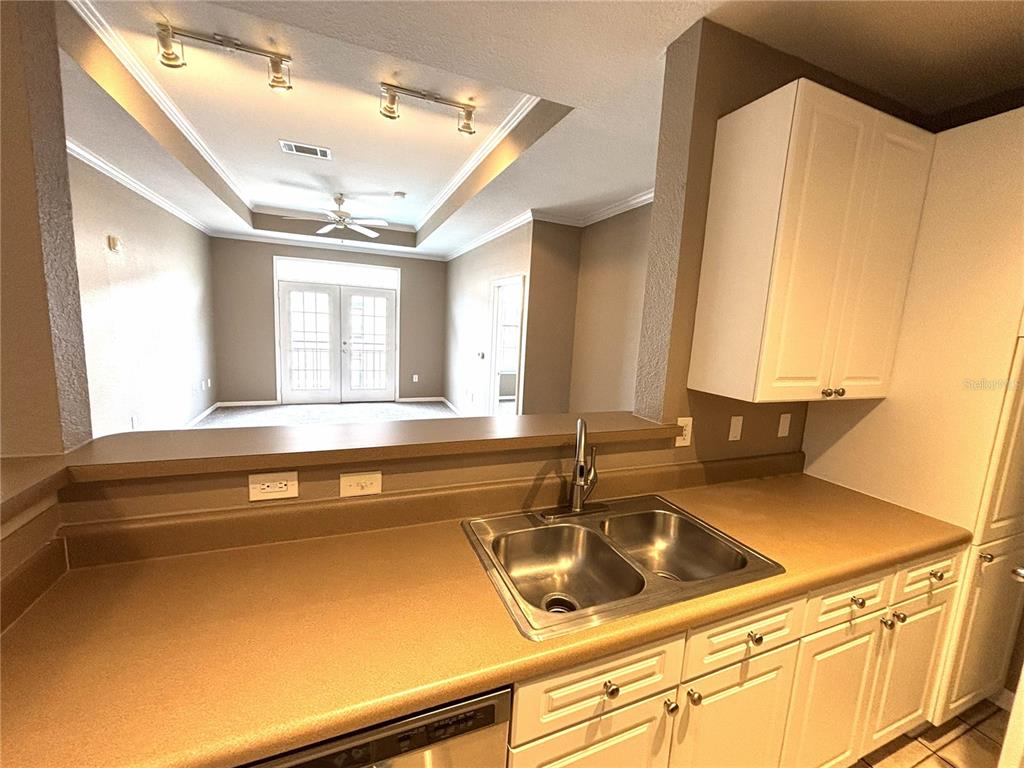 4221 West Spruce Street, Unit 1418 Tampa, FL 33607 - Photo 8 of 22 a kitchen with a sink and a window