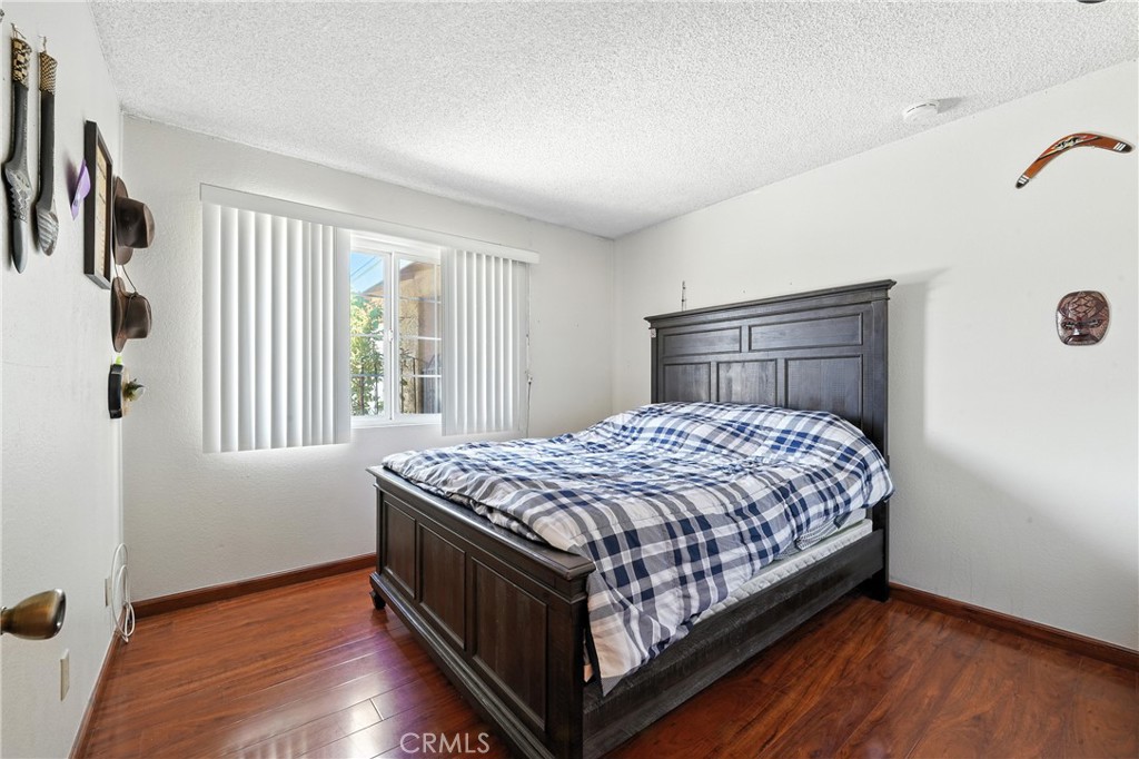 11813 Colima Road Whittier, CA 90604 - Photo 11 of 19 a bedroom with a bed and a window
