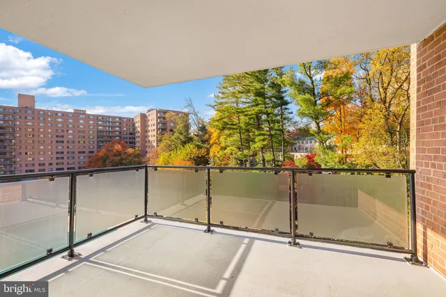 a view of swimming pool with seating space
