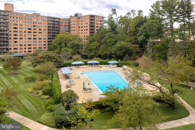 a sign board on a street corner