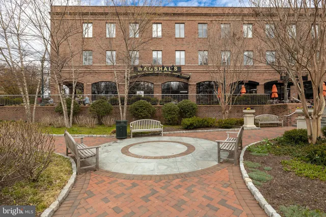 a view of a building with sitting area
