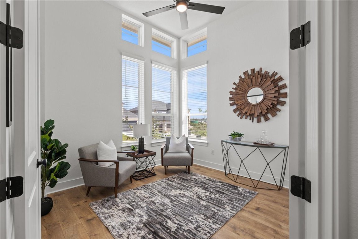 231 Begonia Street Buda, TX 78610 - Photo 16 of 27 a living room with furniture and a rug