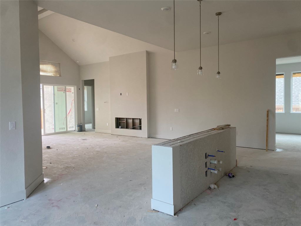 231 Begonia Street Buda, TX 78610 - Photo 4 of 27 a view of hallway with window and cabinet
