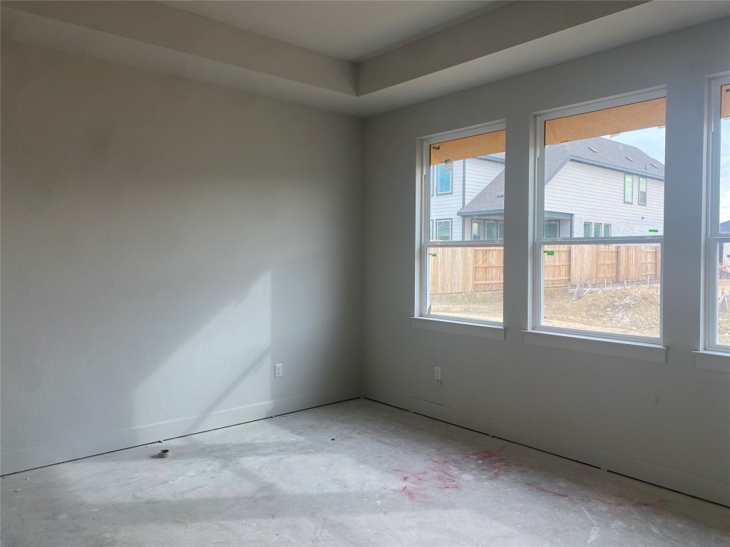231 Begonia Street Buda, TX 78610 - Photo 7 of 27 an empty room with windows