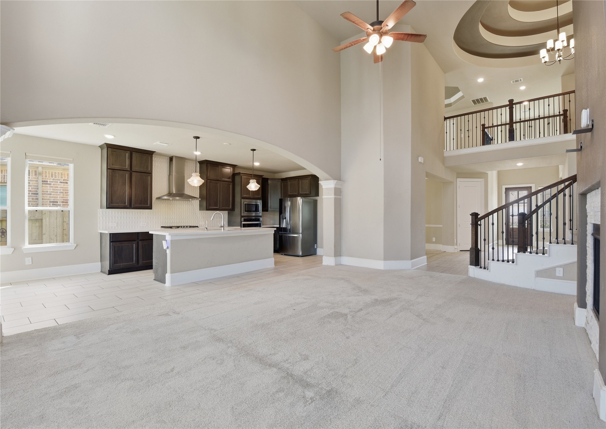 17501 Spice Merlot Lane Conroe, TX 77302 - Photo 17 of 50 a view of a livingroom with furniture and a kitchen
