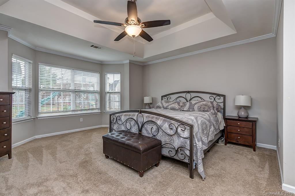 2736 Rustic Ridge Court Rock Hill, SC 29730 - Photo 2 of 23 a bedroom with a bed and a ceiling fan