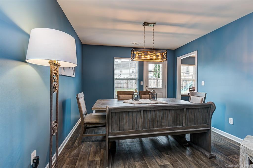 2736 Rustic Ridge Court Rock Hill, SC 29730 - Photo 13 of 23 a view of a dining room with furniture window and wooden floor