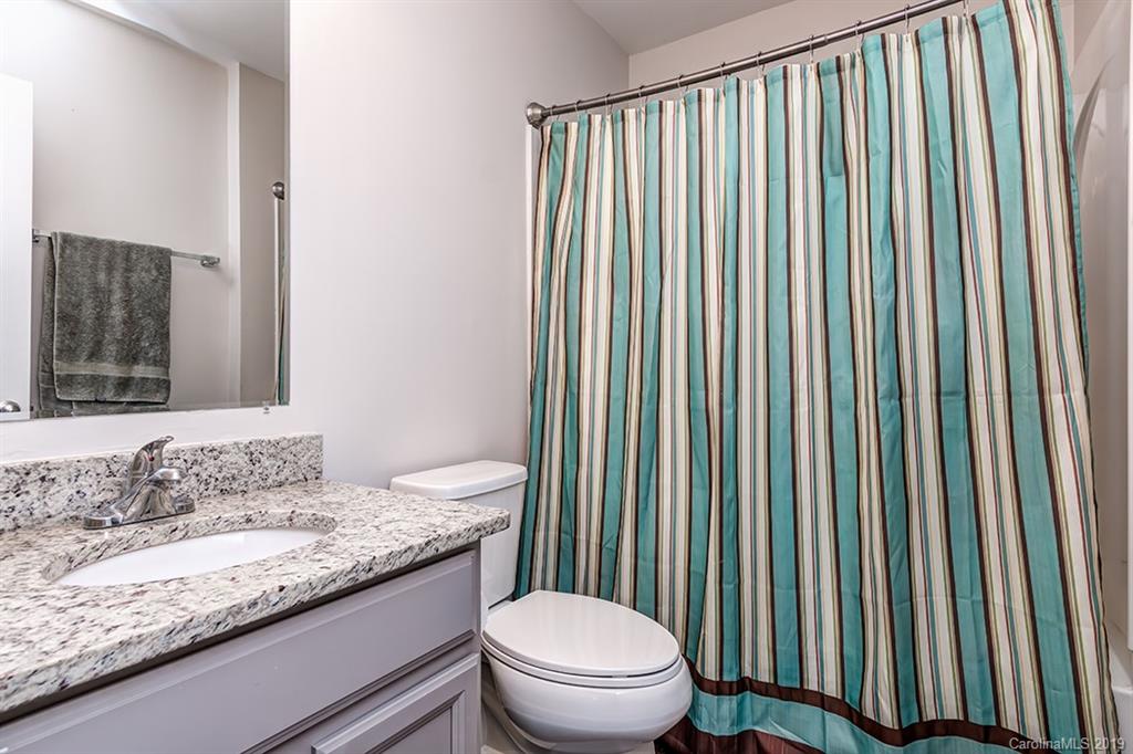 2736 Rustic Ridge Court Rock Hill, SC 29730 - Photo 17 of 23 a bathroom with a granite countertop sink toilet and mirror