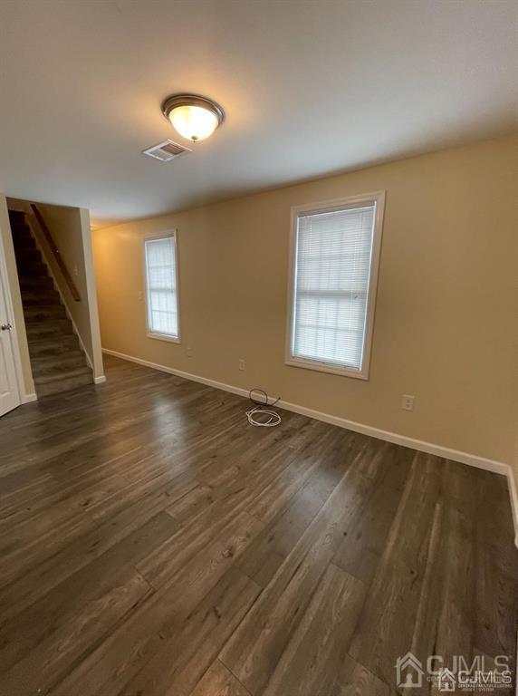 9 Christopher Street, Unit 2 Carteret, NJ 07008 - Photo 14 of 15 a view of an empty room with wooden floor and a window