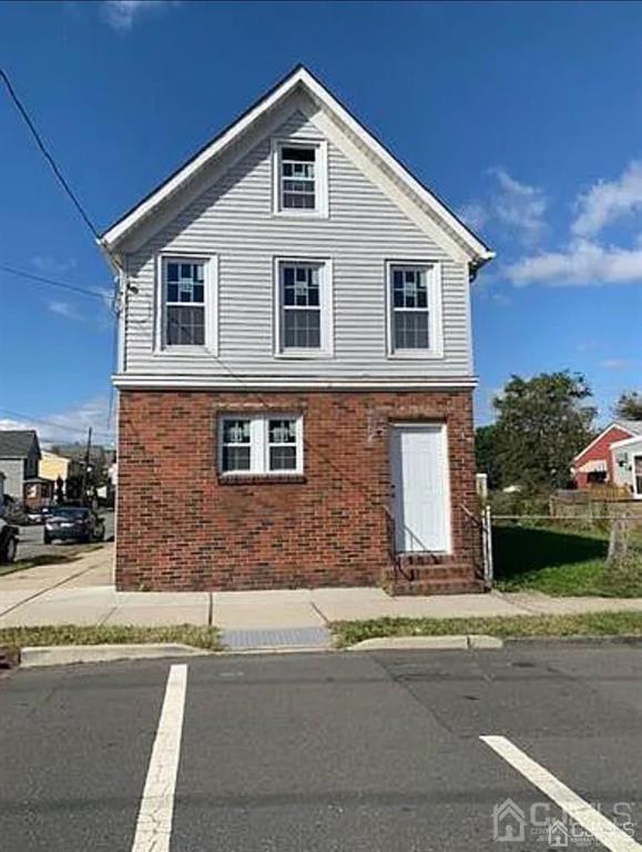 9 Christopher Street, Unit 2 Carteret, NJ 07008 - Photo 2 of 15 a front view of a house with a yard